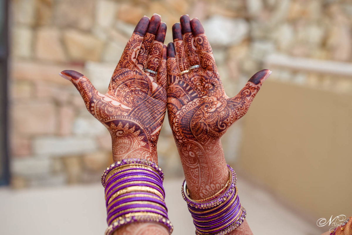 bride's wedding henna desings with purple bangle bracelets at griffin gate marriott