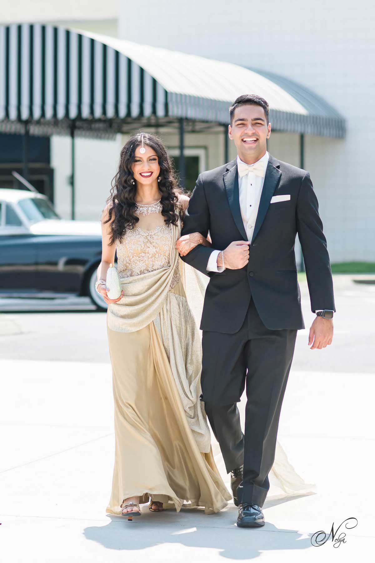 gril in gold dress and guy wearing blck suit for engagement party in Knoxville TN