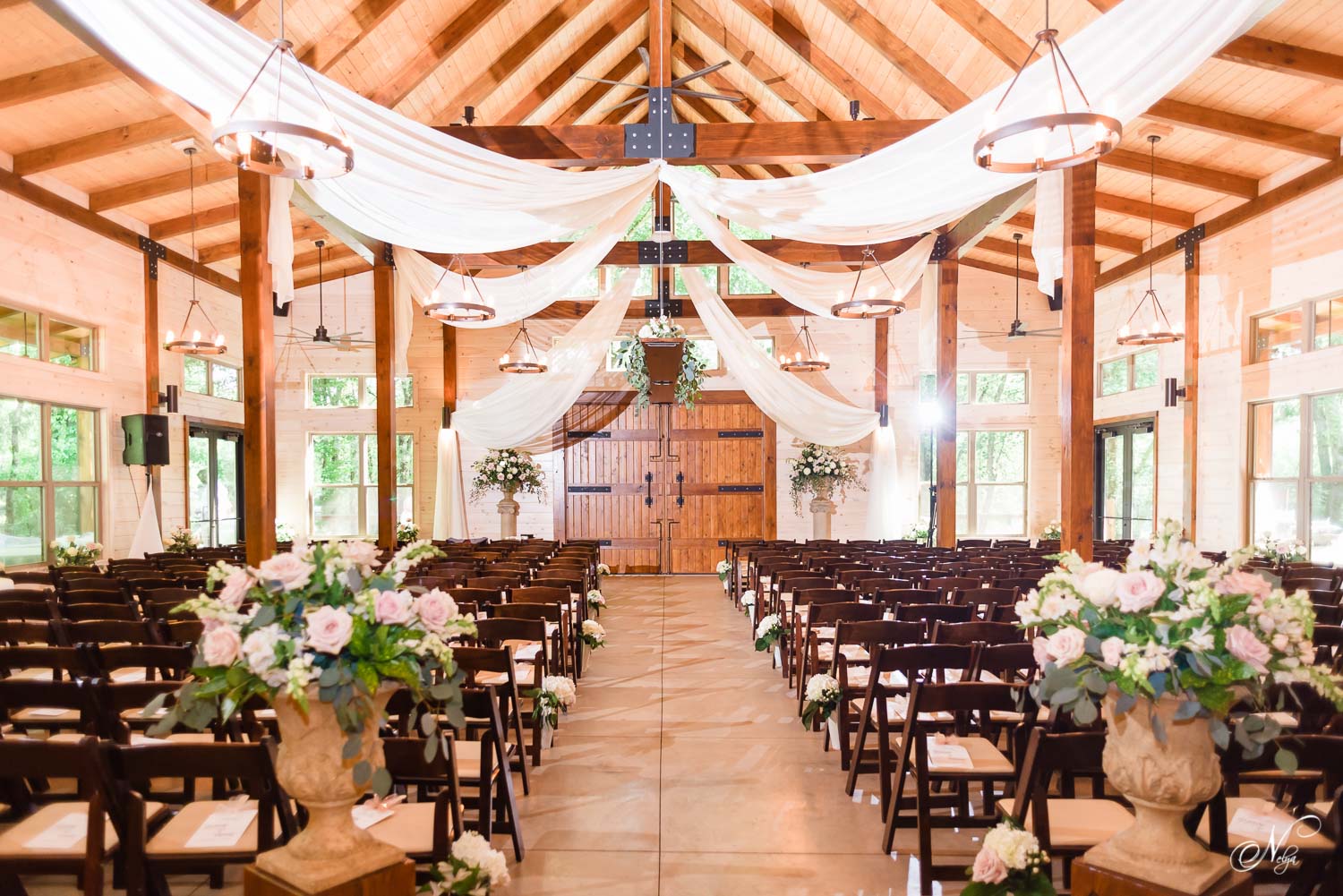 indoor wedding ceremony withchairs from Bradley Rental of Cleveland TN at Hiwassee River weddings