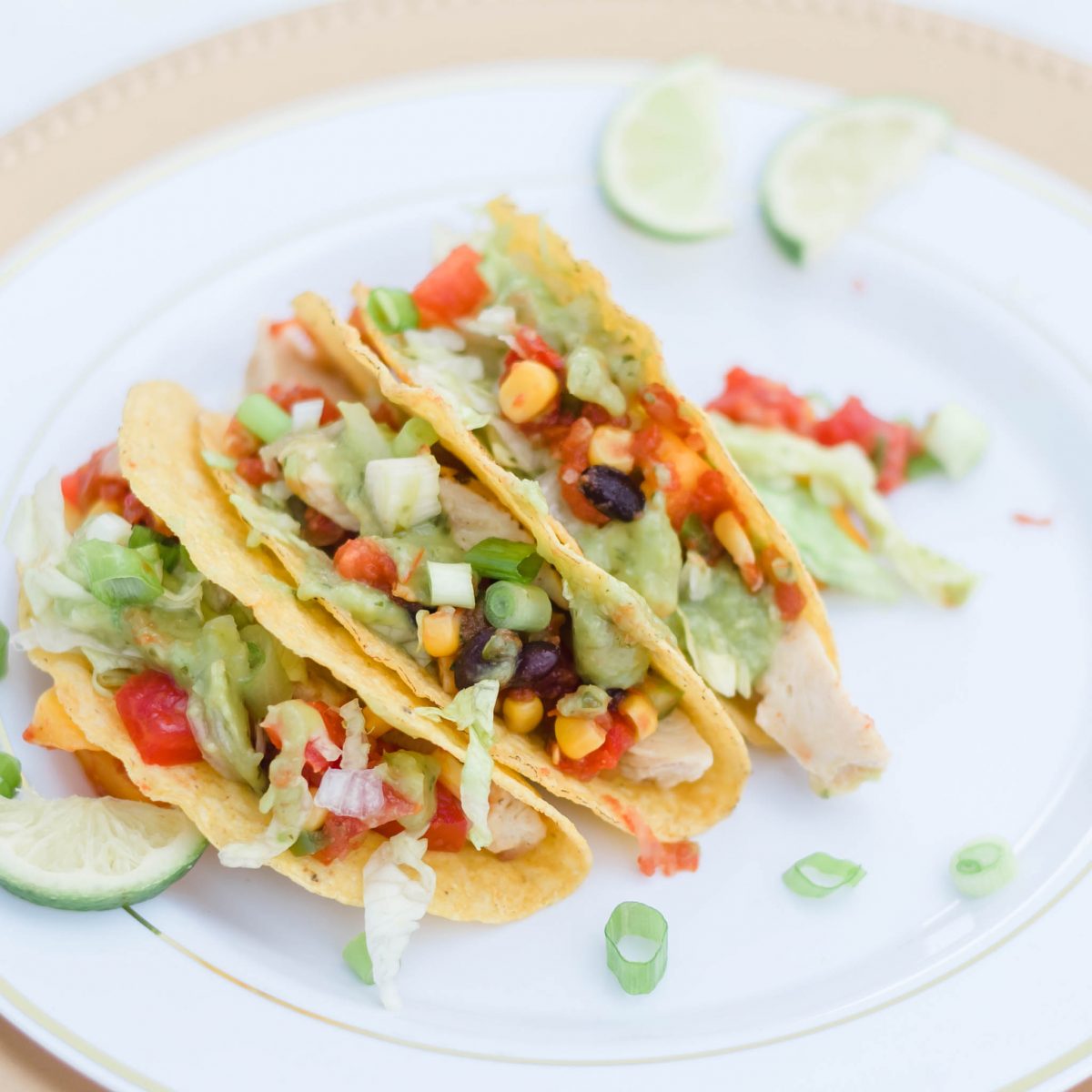 Gluten free Chicken Tacos with tomatoes and lime