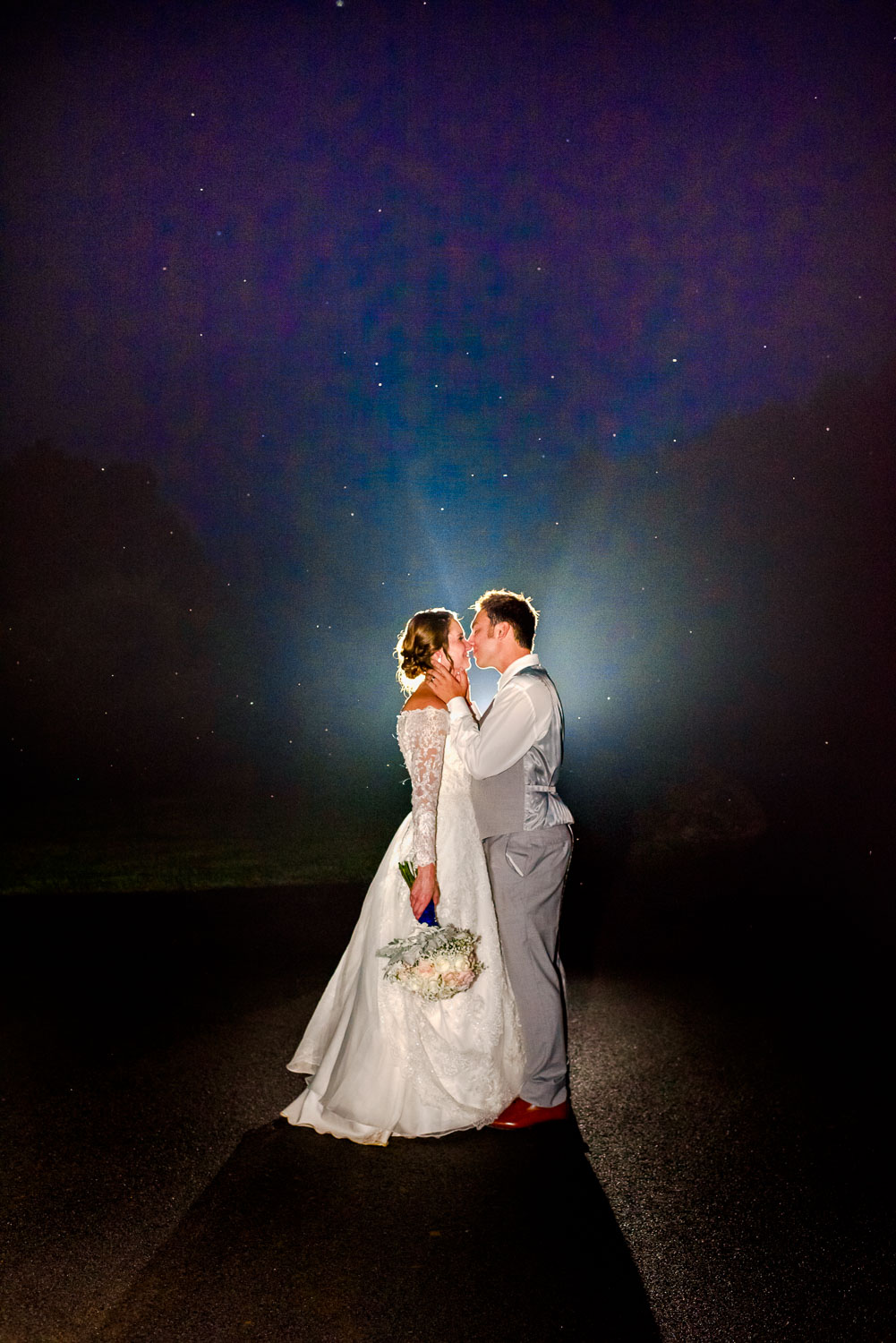 bride and groom standing in the fog at night in Gatlinburg TN