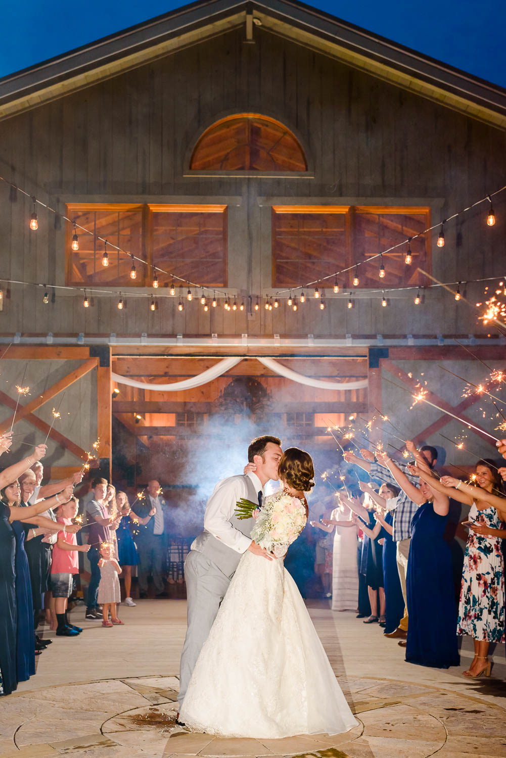 Wedding Exit with sparklers in front of 4 Points Farm venue at night in Gatlinburg TN