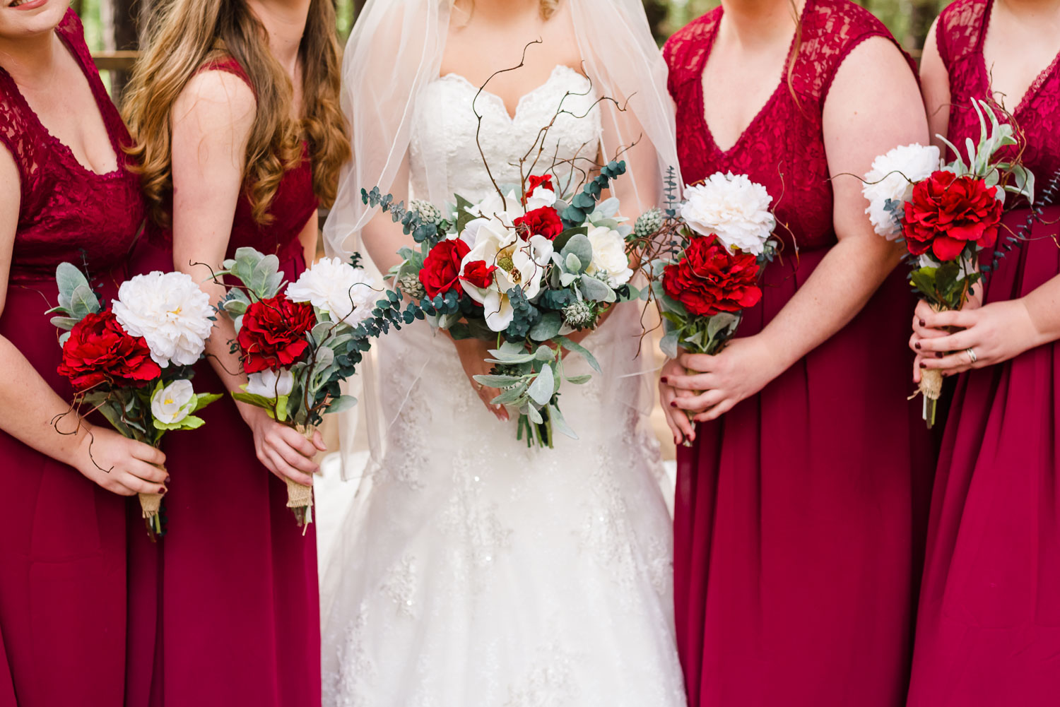 bridesmaids bouquests and bridesmaids dresses in cranberry red for Fall wedding