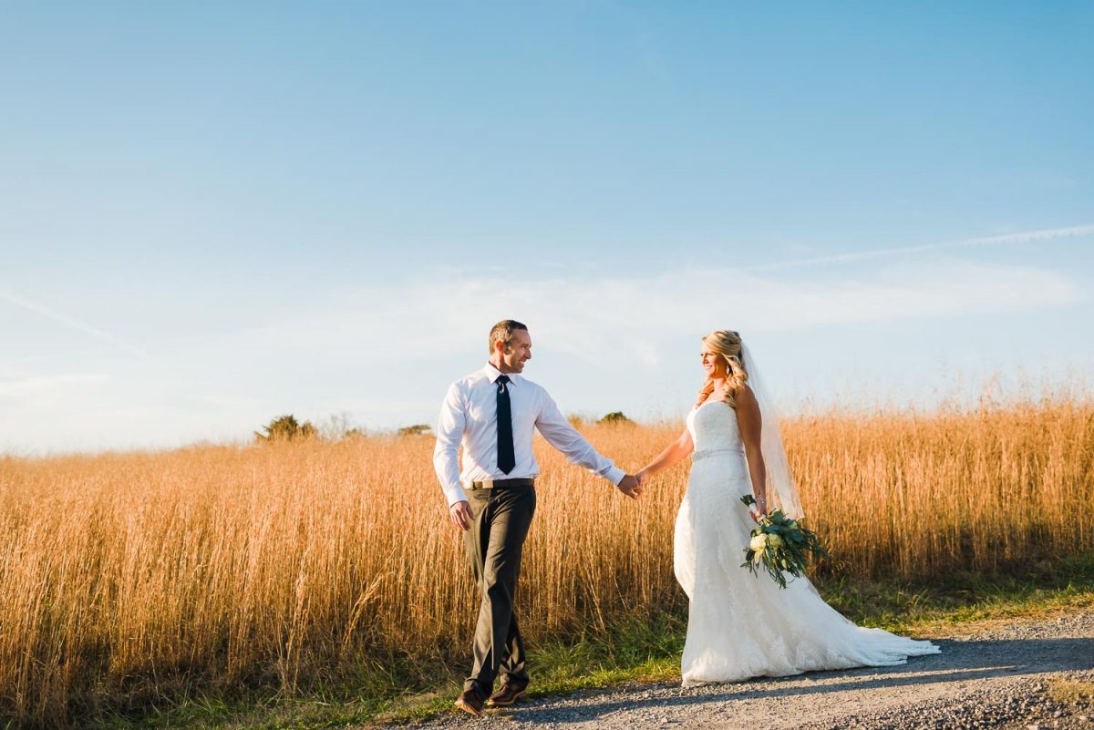 two people walking down road at their november tennessee wedding