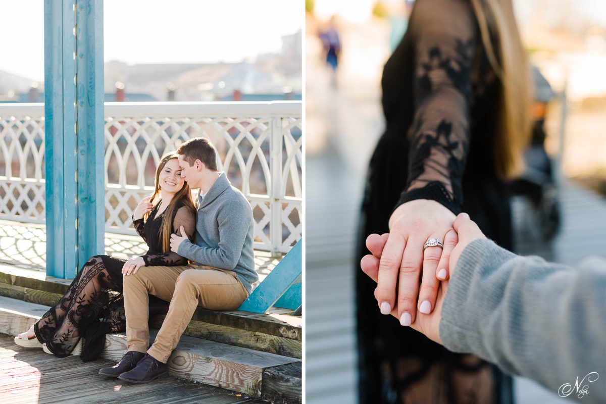 couple sitting on wooden walkway over the tennessee river in Chattanooga. And woman's hand with engagement ring holding a guy's hand 