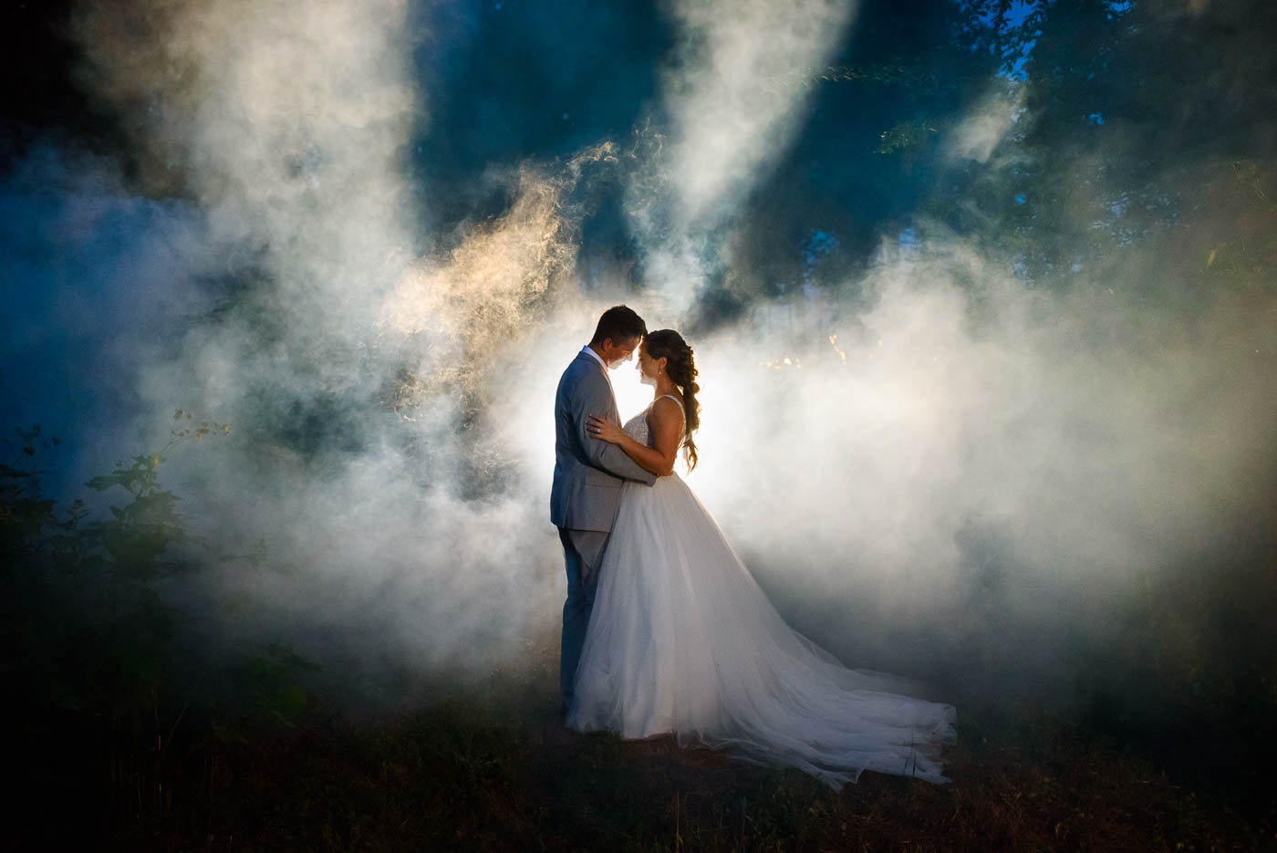 two people outside at night in smoke at Georgia Wedding