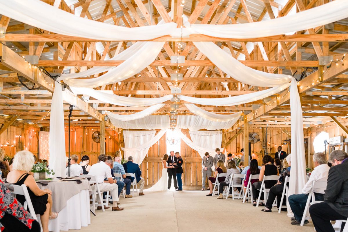 Indoor barn wedding ceremony